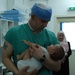 948th FST Begin Lifesaving Procedures on Iraqi Baby