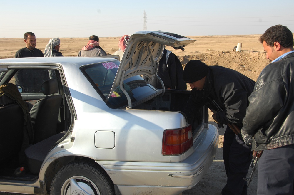Iraqi Police conduct Checkpoint Inspection