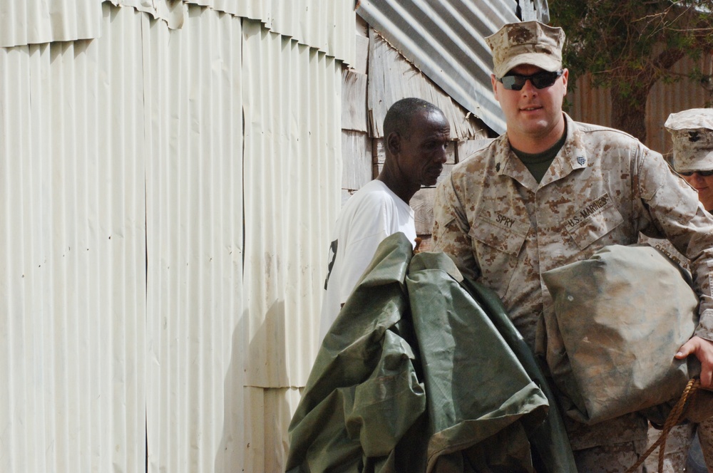 Marines, Sailors hand out supplies to villagers in Petit Douda, Djibouti
