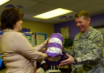 USARCENT DCG reads books at local school