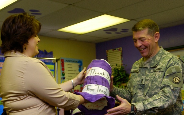 USARCENT DCG reads books at local school