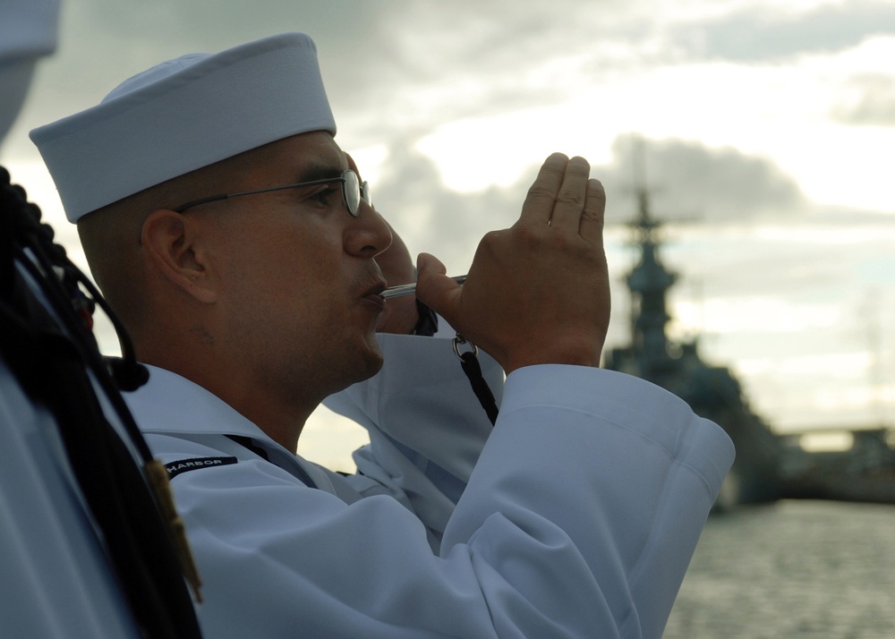 Boatswain Mate Pipes Attention During an Interment Ceremony