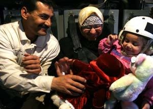 Marines transport precious cargo, reunite healthier toddler with family