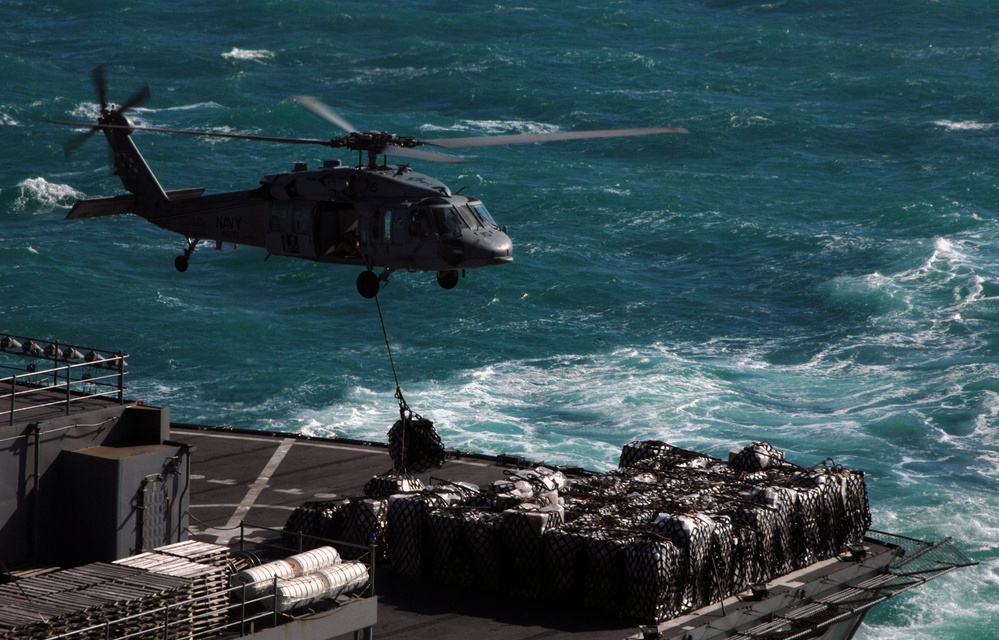 A MH-60S Seahawk Performs a Vertical Replenishment