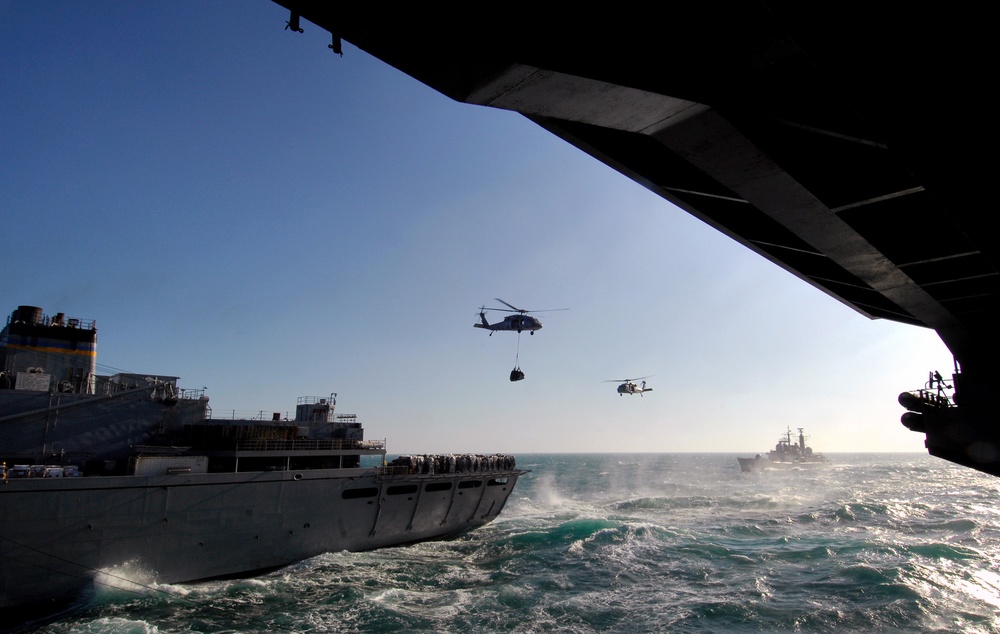 Two MH-60S Seahawks Perform a Replenishment-At-Sea
