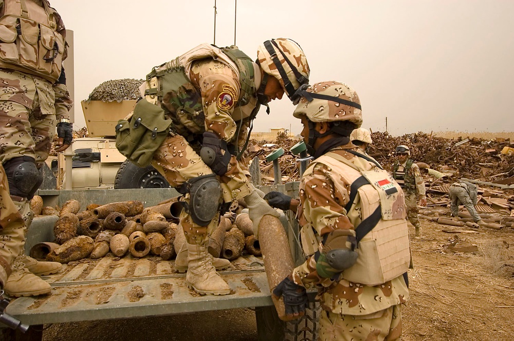 Multi-National Division - Baghdad Troops sweep junkyard for potential munitions