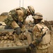 Multi-National Division - Baghdad Troops sweep junkyard for potential munitions