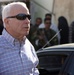 Senator John McCain steps on deck, surveys progress