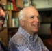 Senator John McCain steps on deck, surveys progress