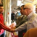 Senator John McCain steps on deck, surveys progress