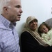 Senator John McCain steps on deck, surveys progress