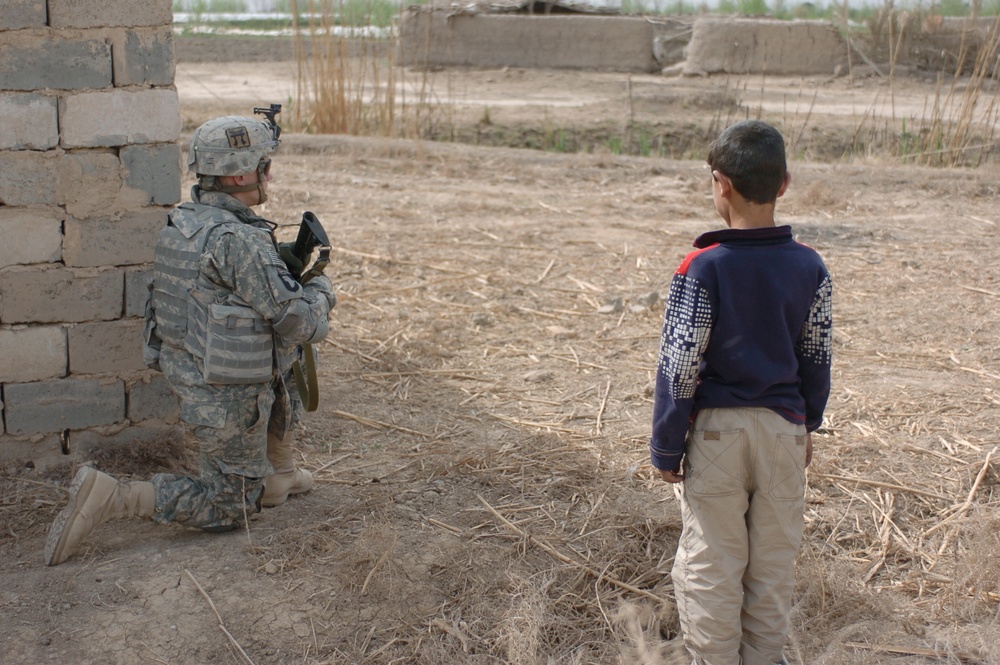Soldiers patrol Minari Village