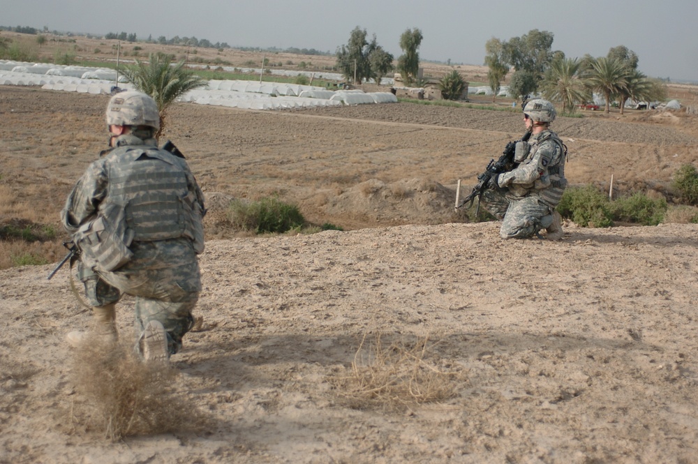 Soldiers patrol Minari Village