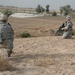 Soldiers patrol Minari Village