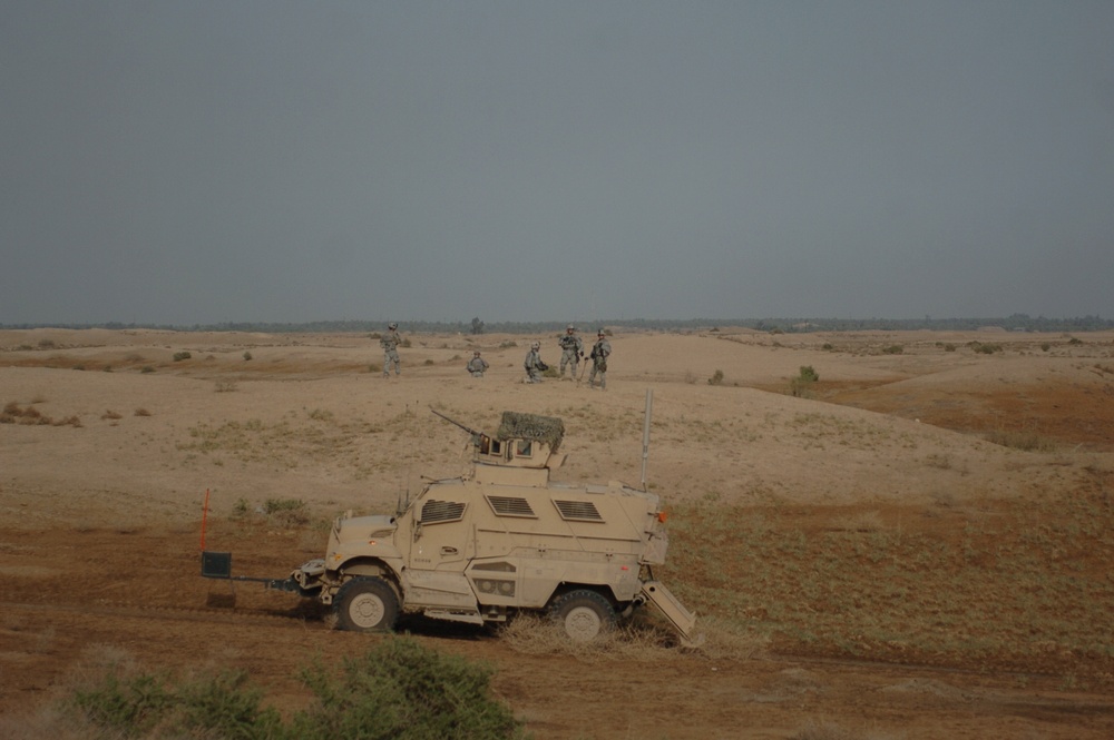 Soldiers patrol Minari Village
