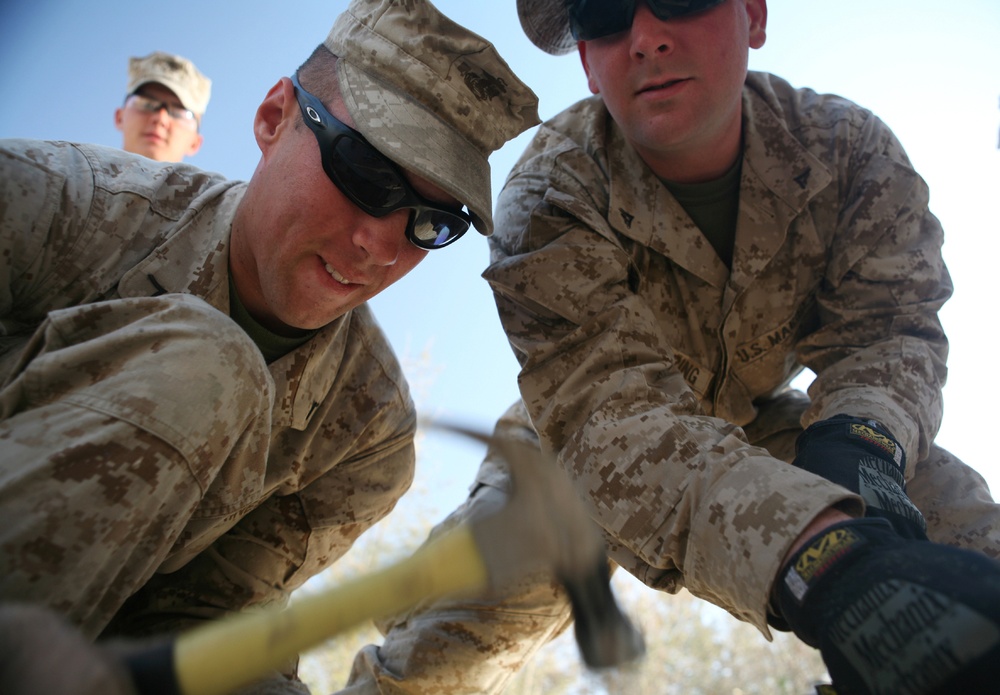 Combat Logistics Battalion-1 cuts ribbon to cut abs