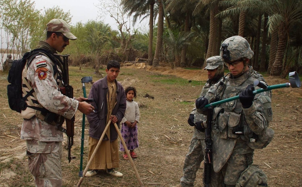 Disabled boy receives crutches from Soldiers