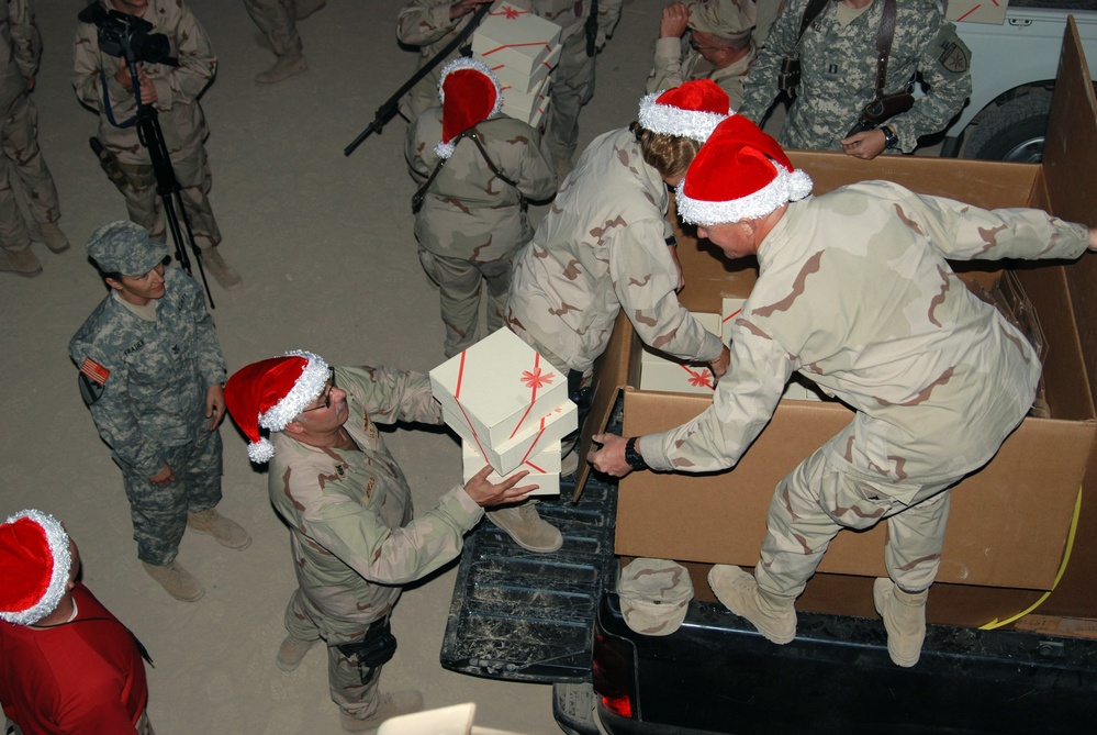 U.S. 5th Fleet distributes holiday gift boxes to Sailors deployed to Camp Victory
