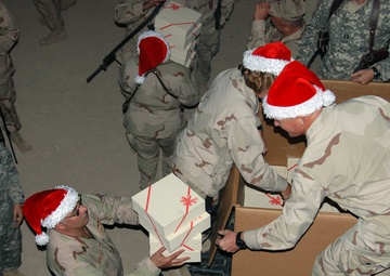 U.S. 5th Fleet distributes holiday gift boxes to Sailors deployed to Camp Victory