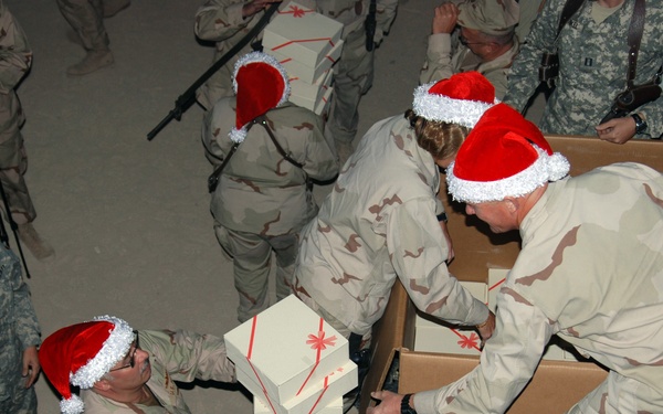 U.S. 5th Fleet distributes holiday gift boxes to Sailors deployed to Camp Victory