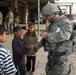 Soldiers shop, greet people at the market