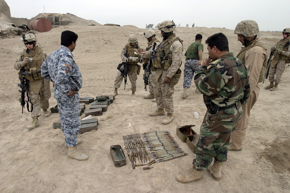 Iraqi security forces and Marines uncover 4,000 pound cache