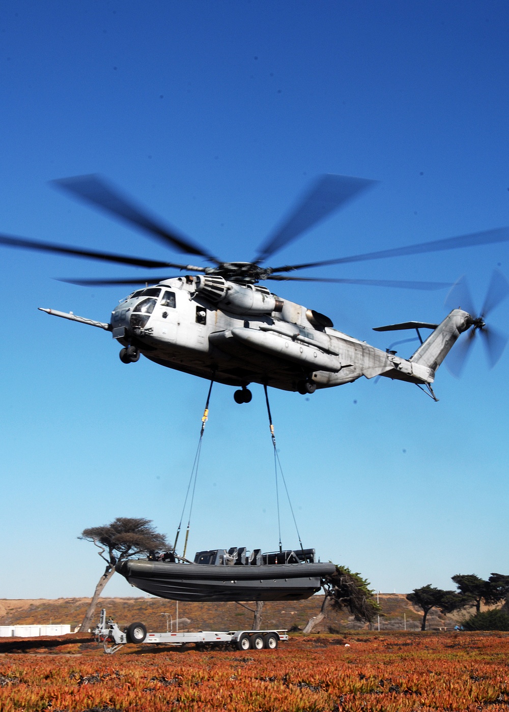 Helicopter Lifts a Rigid Hull Inflatable Boat