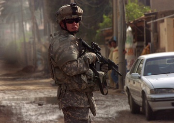 Soldiers of Btry. B, 5-25 FA patrol through Karadah