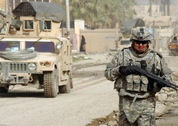 Soldiers of Btry. B, 5-25 FA patrol through Karadah