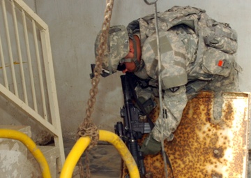 Soldiers of Btry. B, 5-25 FA patrol through Karadah