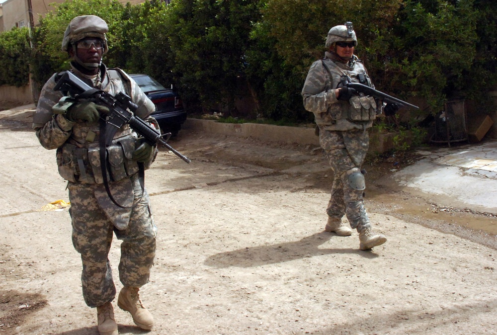 Soldiers of Btry. B, 5-25 FA patrol through Karadah