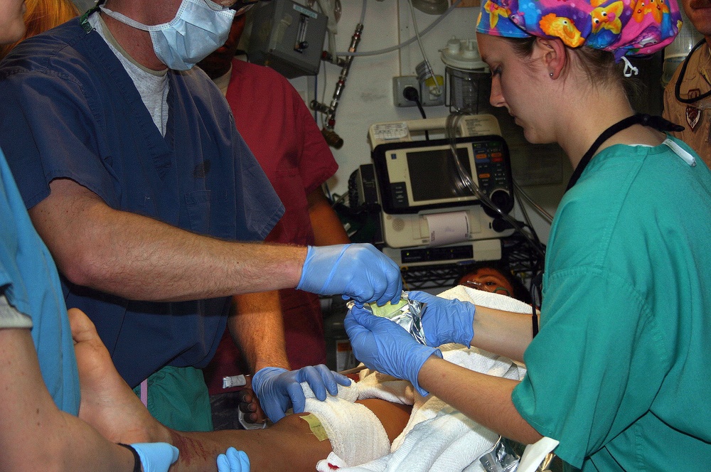 Coalition Forces Save Iraqi Teenager Injured by IED