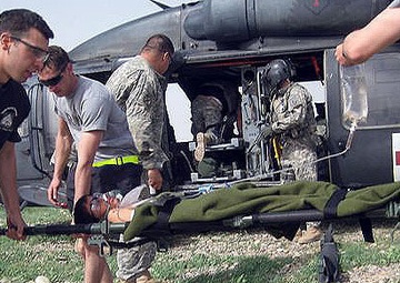 Coalition Forces Save Iraqi Teenager Injured by IED