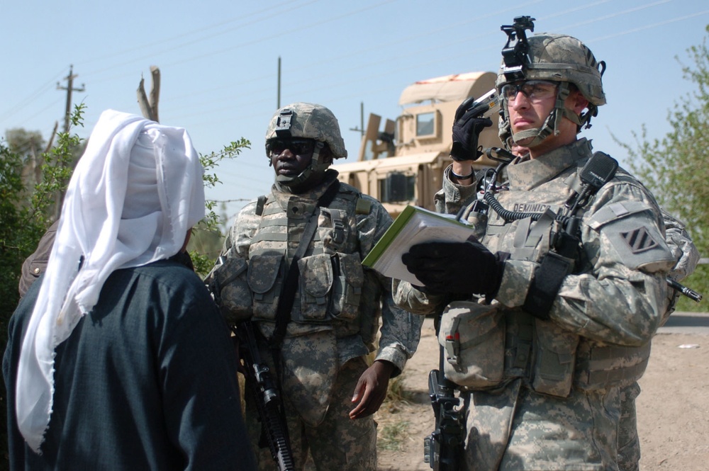 Soldiers assess orchards in al Buaytha