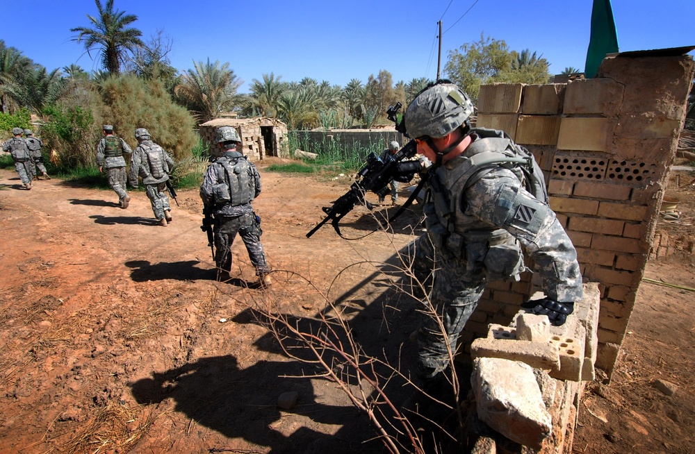 Soldiers patrol in Abu Jassim