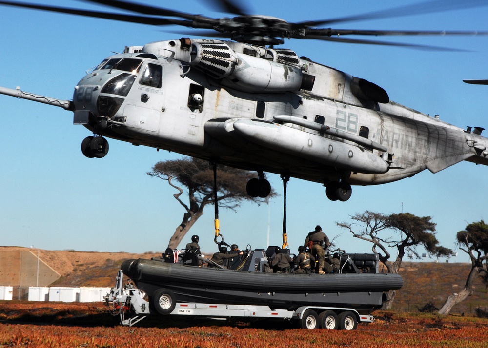 Helicopter Lifts a Rigid Hull Inflatable Boat