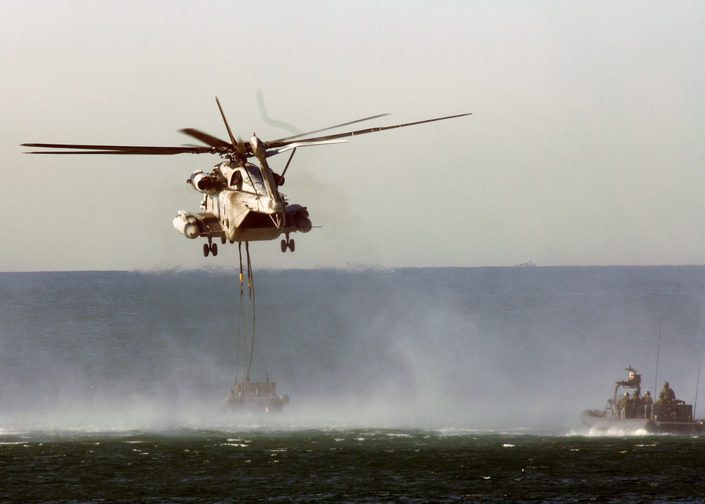 Helicopter Lifts a Rigid Hull Inflatable Boat