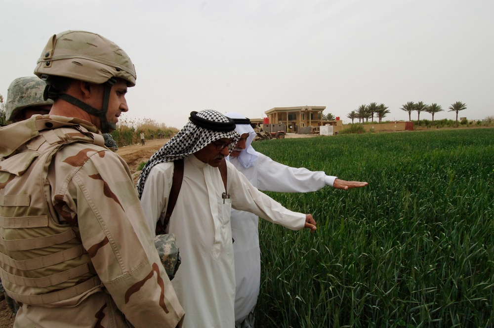 Rear Adm. Smith sees agriculture during visit to Taji