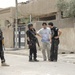 Iraqi police patrol Rashid district