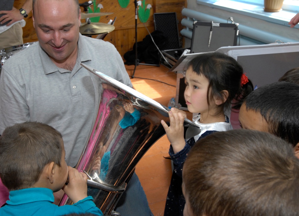 Band members connect with Bishkek music students