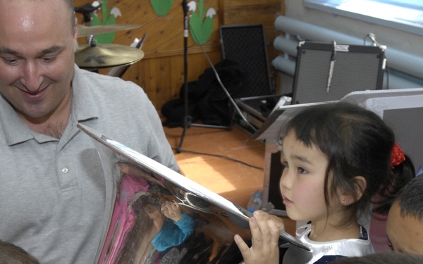 Band members connect with Bishkek music students