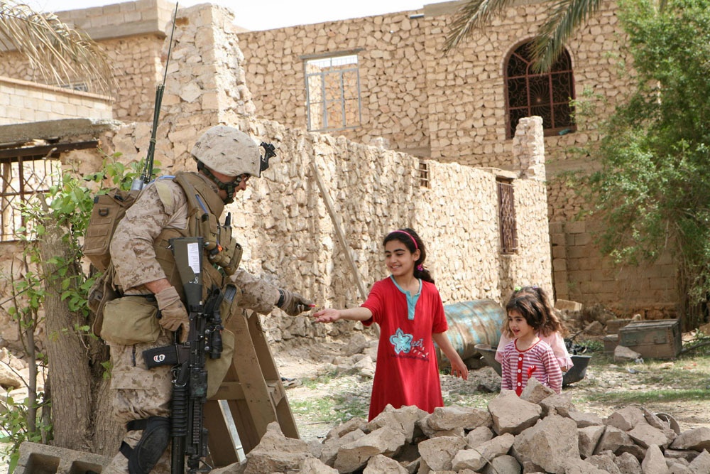 Marines make kids happy during patrol