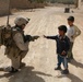 Marines make kids happy during patrol