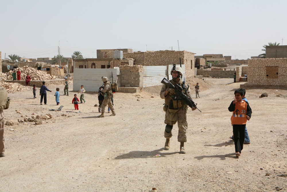 Marines make kids happy during patrol