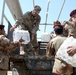 Iraqi army soldiers distribute food, water to Baghdad residents