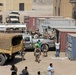 Iraqi army soldiers distribute food, water to Baghdad residents
