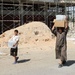 Iraqi army soldiers distribute food, water to Baghdad residents