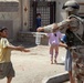 Iraqi army soldiers distribute food, water to Baghdad residents
