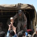 Iraqi army soldiers distribute food, water to Baghdad residents