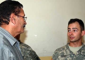 Multi-National Division - Baghdad Soldiers bring gifts to Victory Base Complex area school